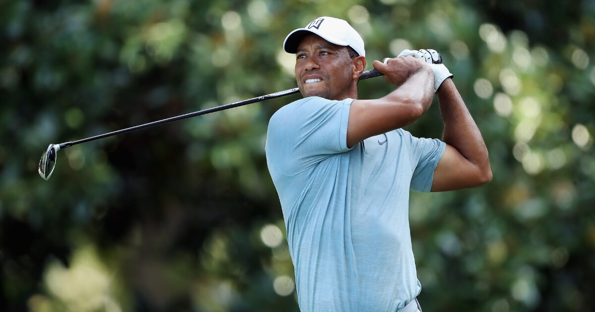 Tiger Woods plays his shot from the 17th tee Friday during the second round of the TOUR Championship at East Lake Golf Club in Atlanta.