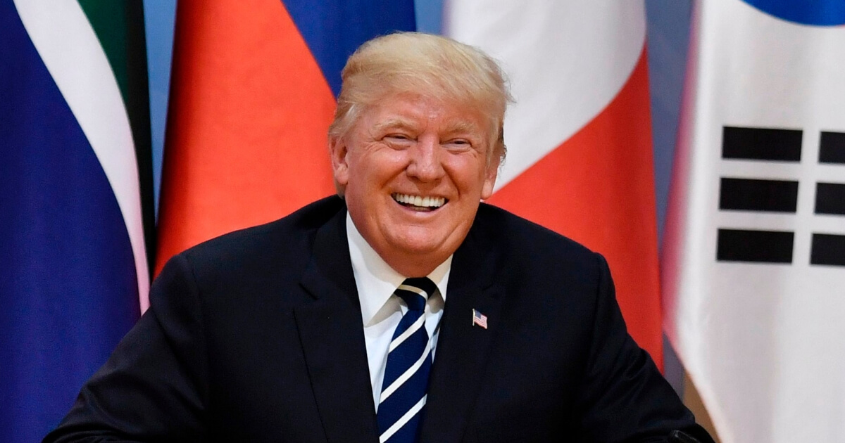 President Donald Trump laughs during the first day of the G20 summit in July 2017.