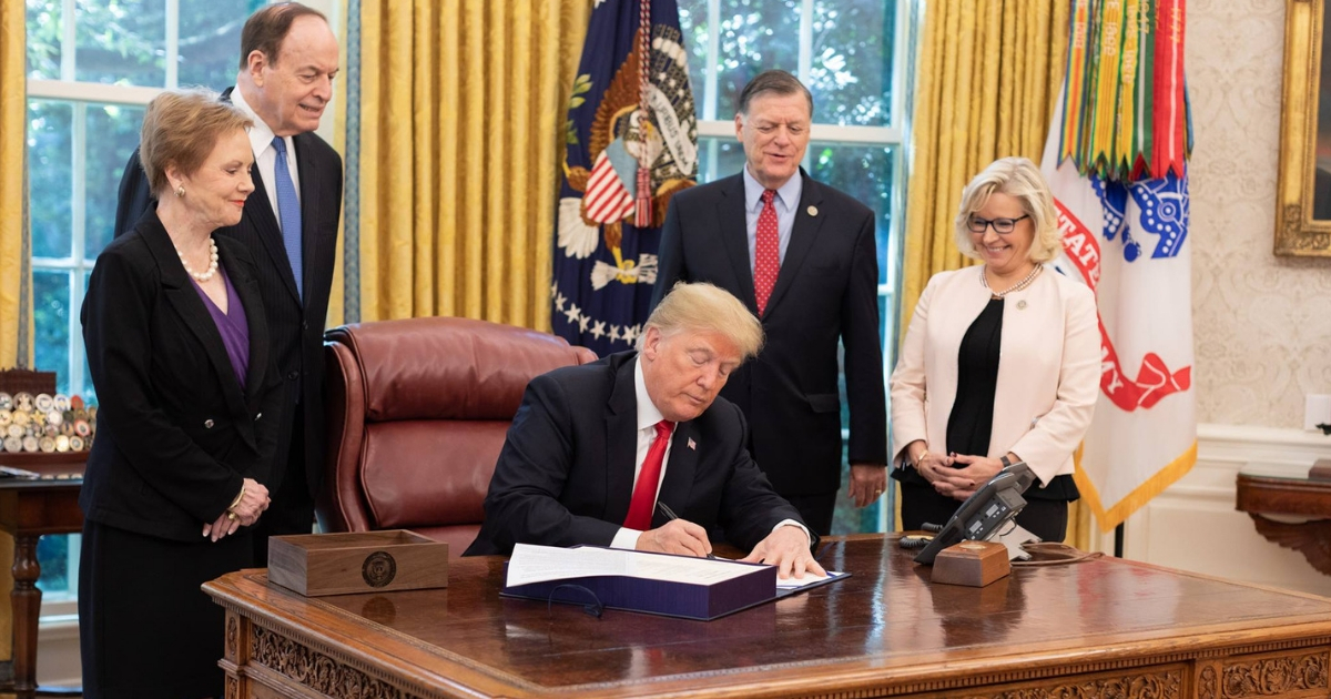 President Donald Trump signs the spending bill H.R. 6157.