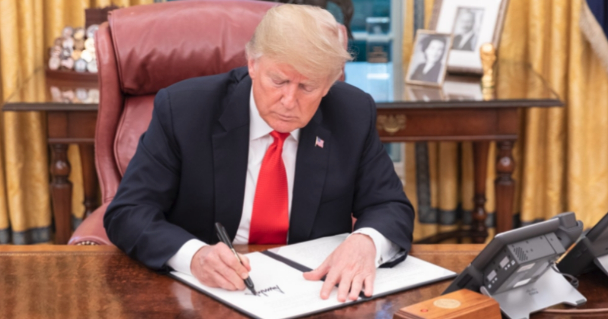 President Donald Trump signs a proclamation declaring Tuesday as "Patriot Day 2018."
