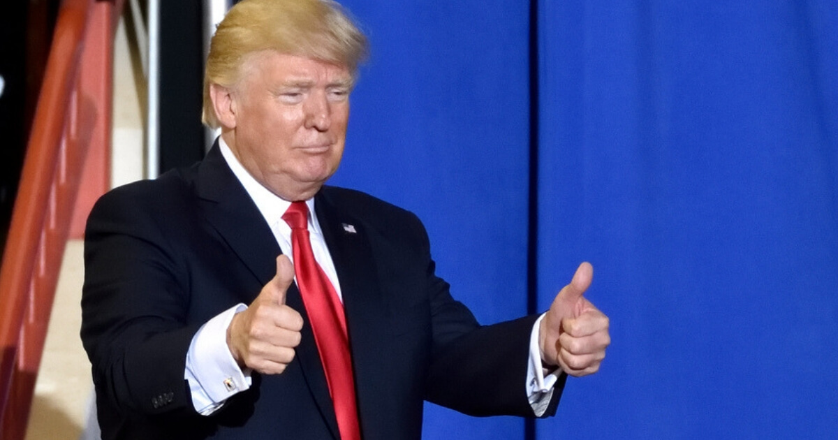 President Donald Trump giving a two thumbs up gesture as he exits the stage of a rally in Harrisburg, Pennsylvania