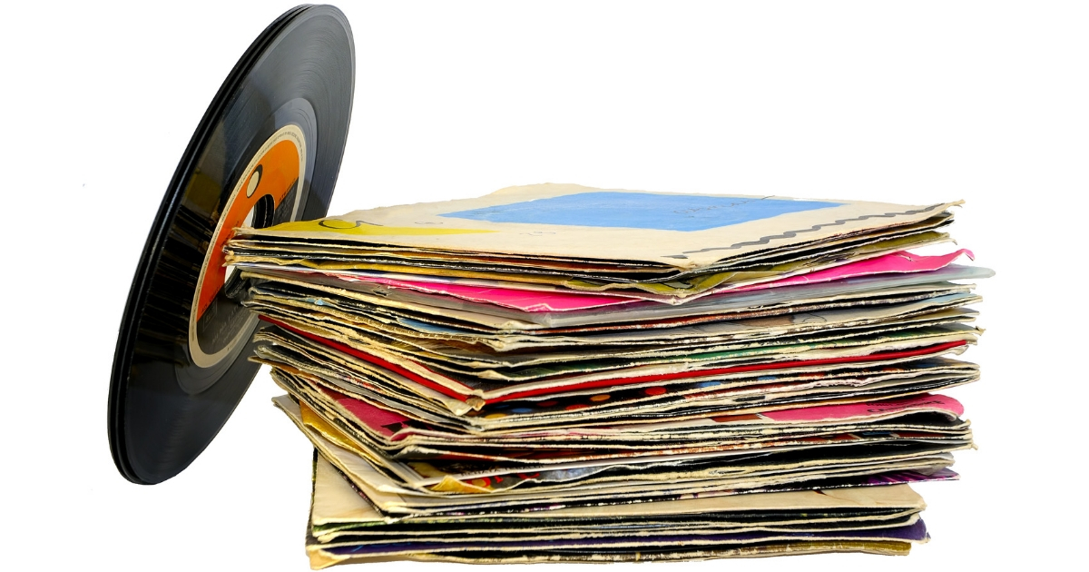 A stack of 45 rpm vinyl records.