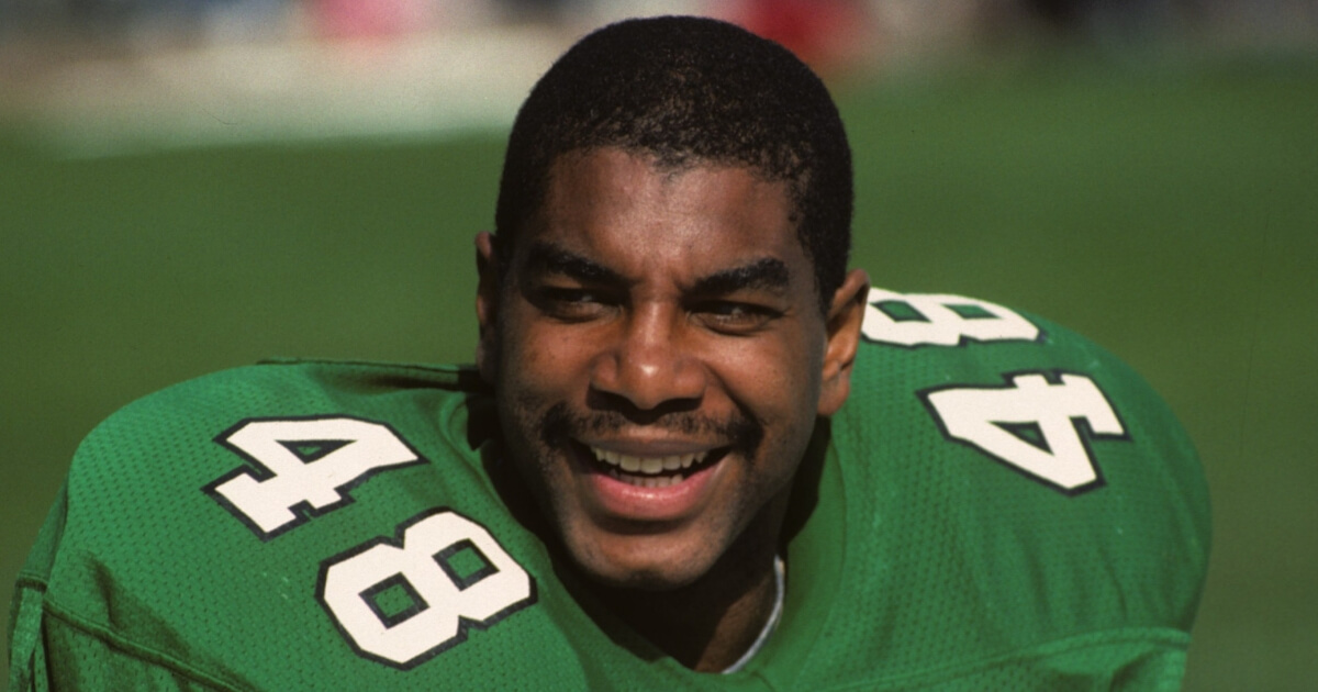 Defensive back Wes Hopkins of the Philadelphia Eagles smiles while on the sideline during a game against the Browns at Municipal Stadium on Oct. 16, 1988, in Cleveland.