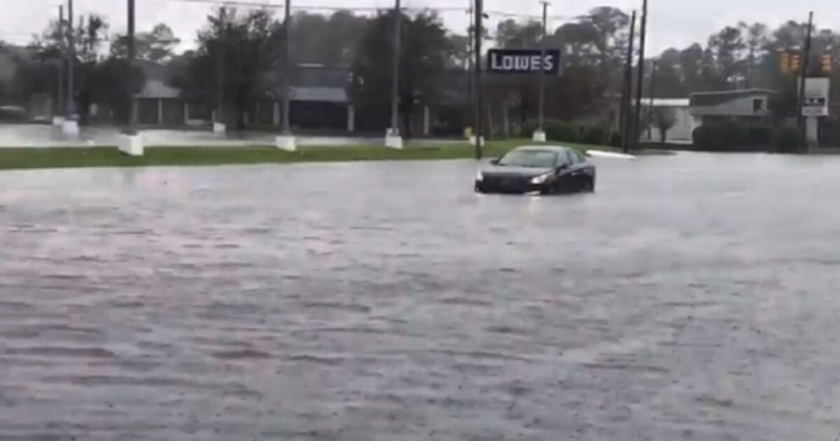A car surrounded by water gives some idea of how much flooding Wilmington, North Carolina, is enduring in the aftermath of Hurricane Florence.