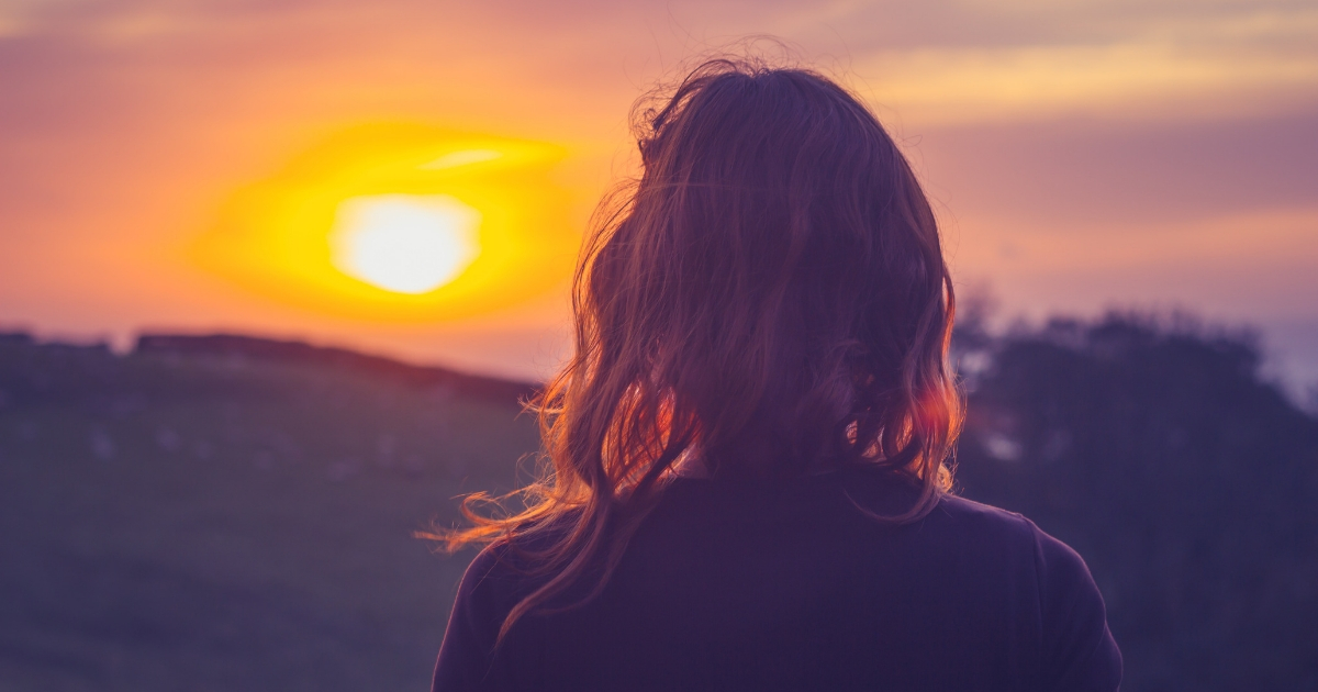 Woman at sunset.