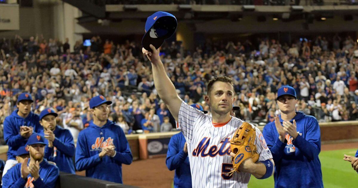 New York Mets third baseman David Wright (5) acknowledges the fans as he leaves the field after coming out of Saturday's game against the Miami Marlins in New York.