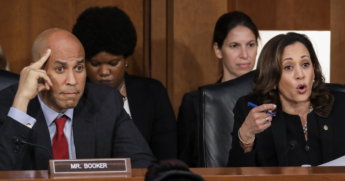 Sen. Cory Booker looks on as Sen. Kamala Harris questions Supreme Court nominee Judge Brett Kavanaugh before the Senate Judiciary Committee.