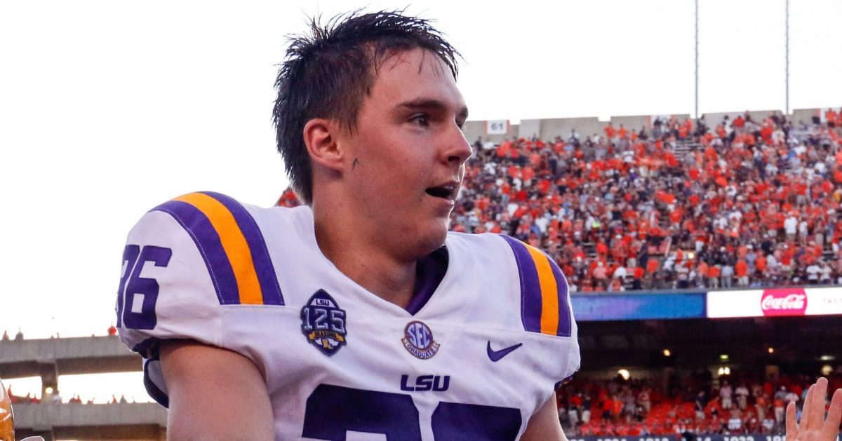 LSU place kicker Cole Tracy is hoisted on the shoulders of his teammates after kicking the winning field goal to defeat Auburn 22-21 during the second half Saturday in Auburn, Alabama.