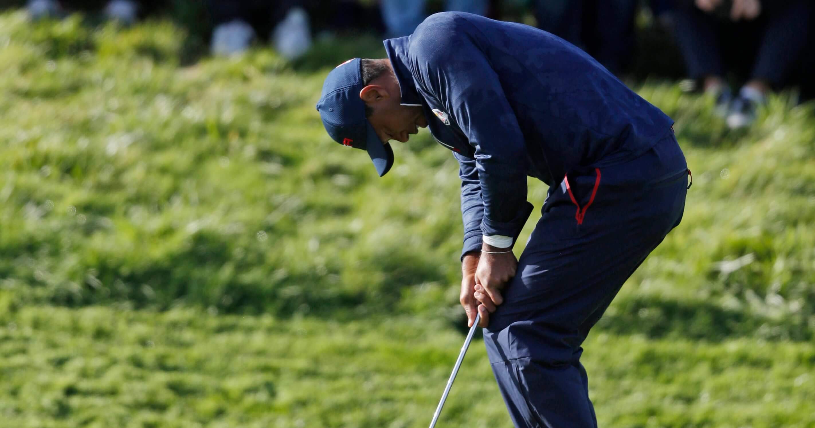 Tiger Woods reacts after missing a putt Saturday on the eighth green during a fourball match on the second day of the 42nd Ryder Cup at Le Golf National in Saint-Quentin-en-Yvelines, outside Paris.