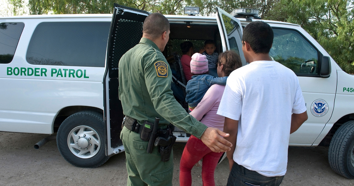 Border Patrol officers with illegal immigrants.