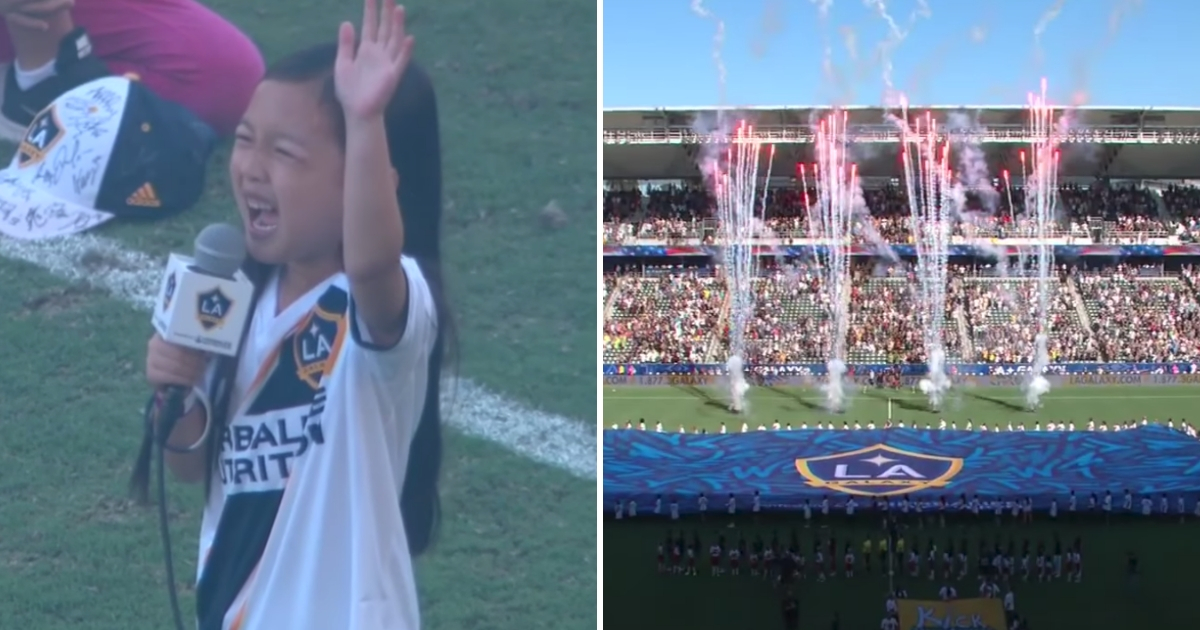 A little girl sings the national anthem and fireworks explode.