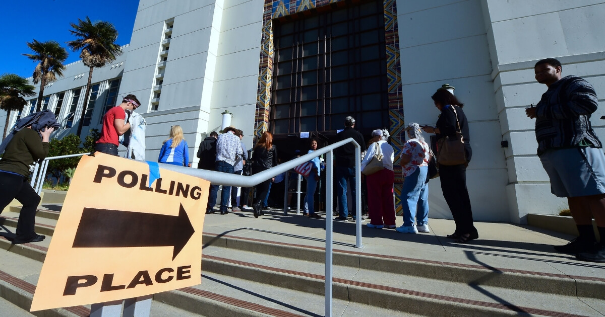 People wait in line to vote in the US presidential election at Santa Monica City Hall