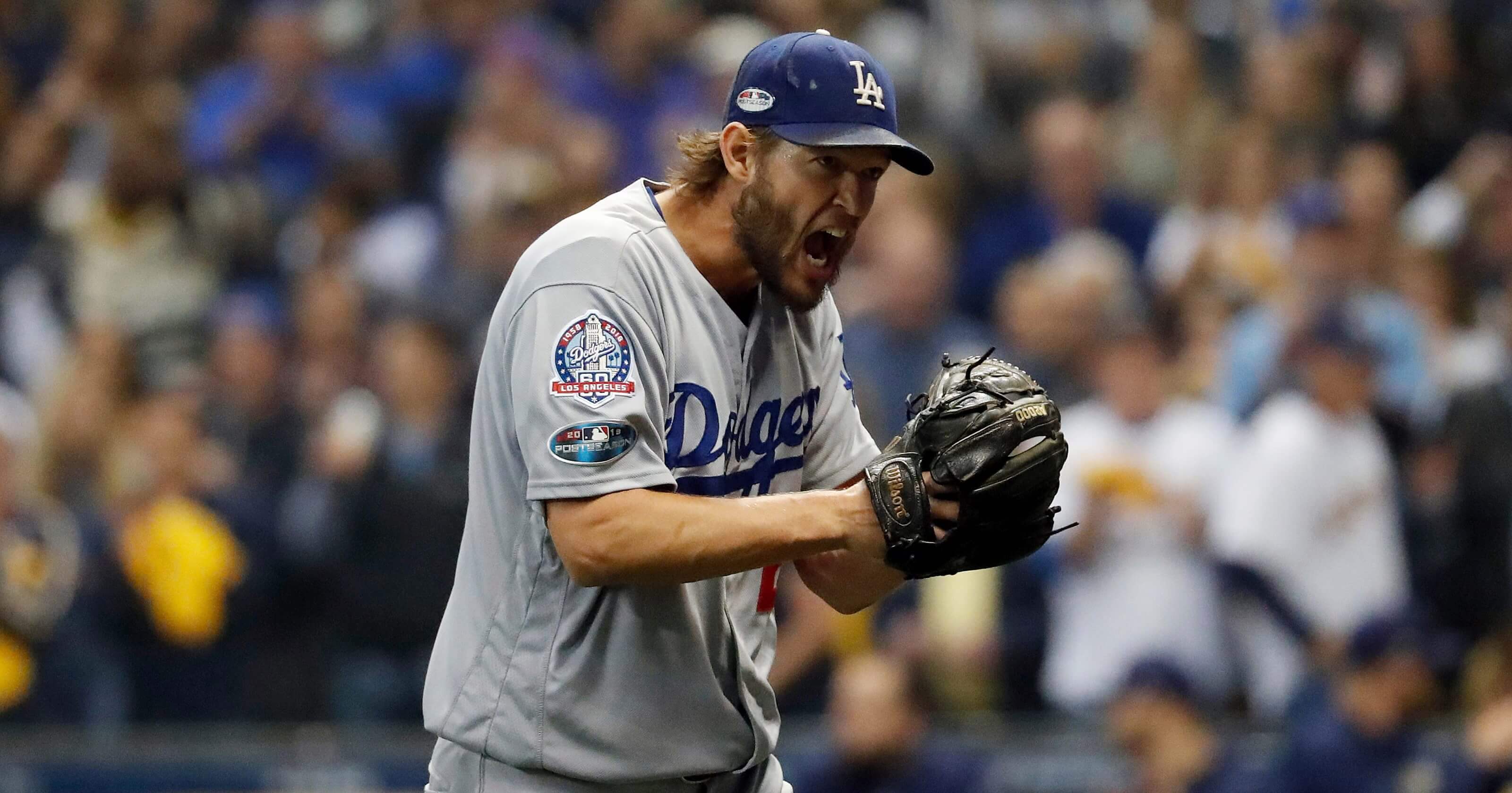 Los Angeles Dodgers starting pitcher Clayton Kershaw yells as he walks off after the third inning of Game 1 of the National League Championship Series game against the Milwaukee Brewers on Friday.