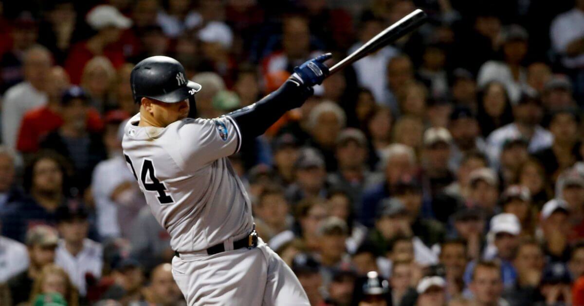 New York Yankees' catcher Gary Sanchez watches his three-run home run against the Boston Red Sox during Game 2 of the American League Division Series, Saturday in Boston.