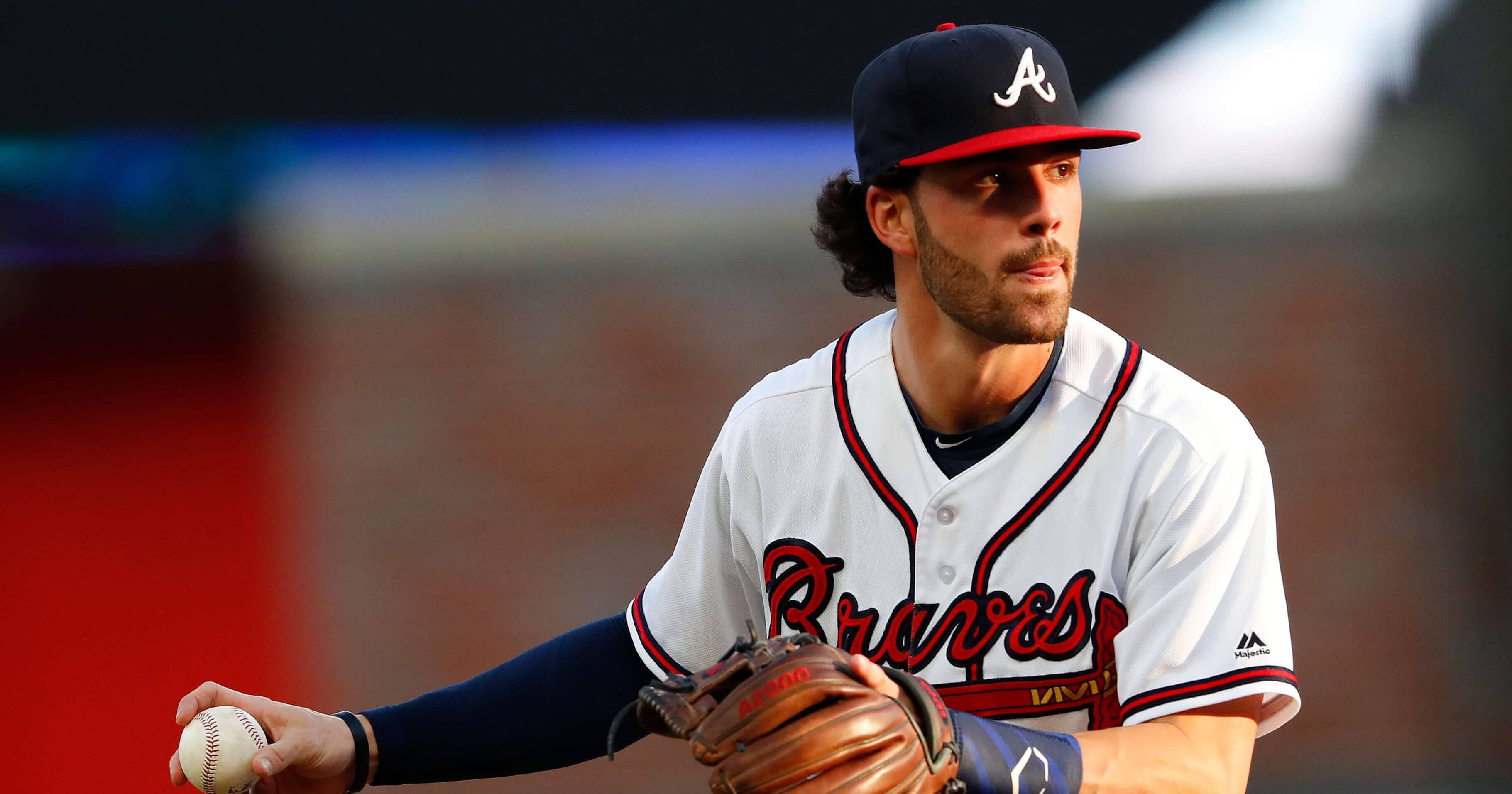 In this May 30, 2018, file photo, Atlanta Braves shortstop Dansby Swanson (7) warms up before the first inning of a baseball game against the New York Mets, in Atlanta. The Braves are trying to determine the status of shortstop Dansby Swanson, who has a sore wrist, as they prepare to open their NLDS against the Los Angeles Dodgers.