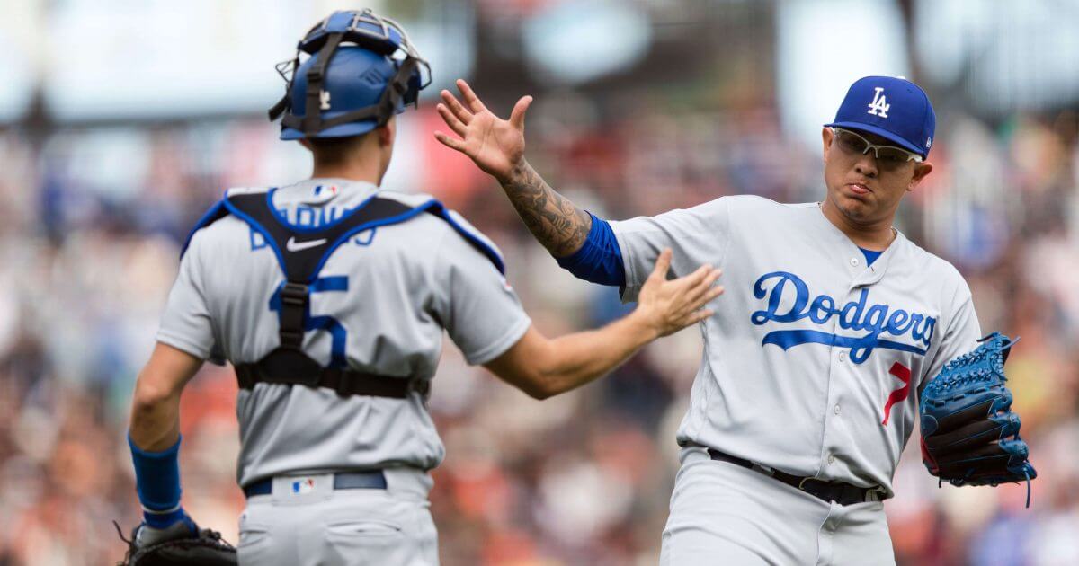 Los Angeles Dodgers catcher Austin Barnes, left, and relief pitcher Julio Urias celebrate after defeating the San Francisco Giants on Sunday.