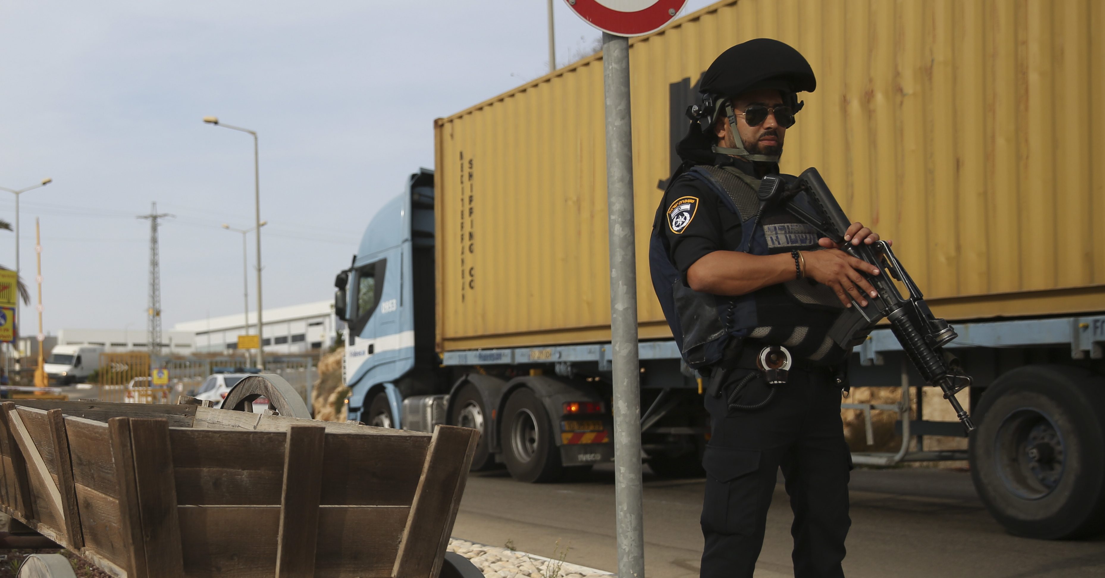 Israeli policemen stand at the entrance of Barkan industrial zone in the West Bank