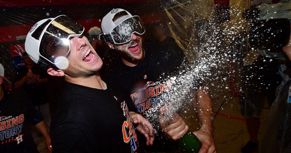 Houston Astros' Alex Bregman, left, and Jake Marisnick celebrate after defeating the Cleveland Indians 11-3 in Game 3 of the American League Division Series.