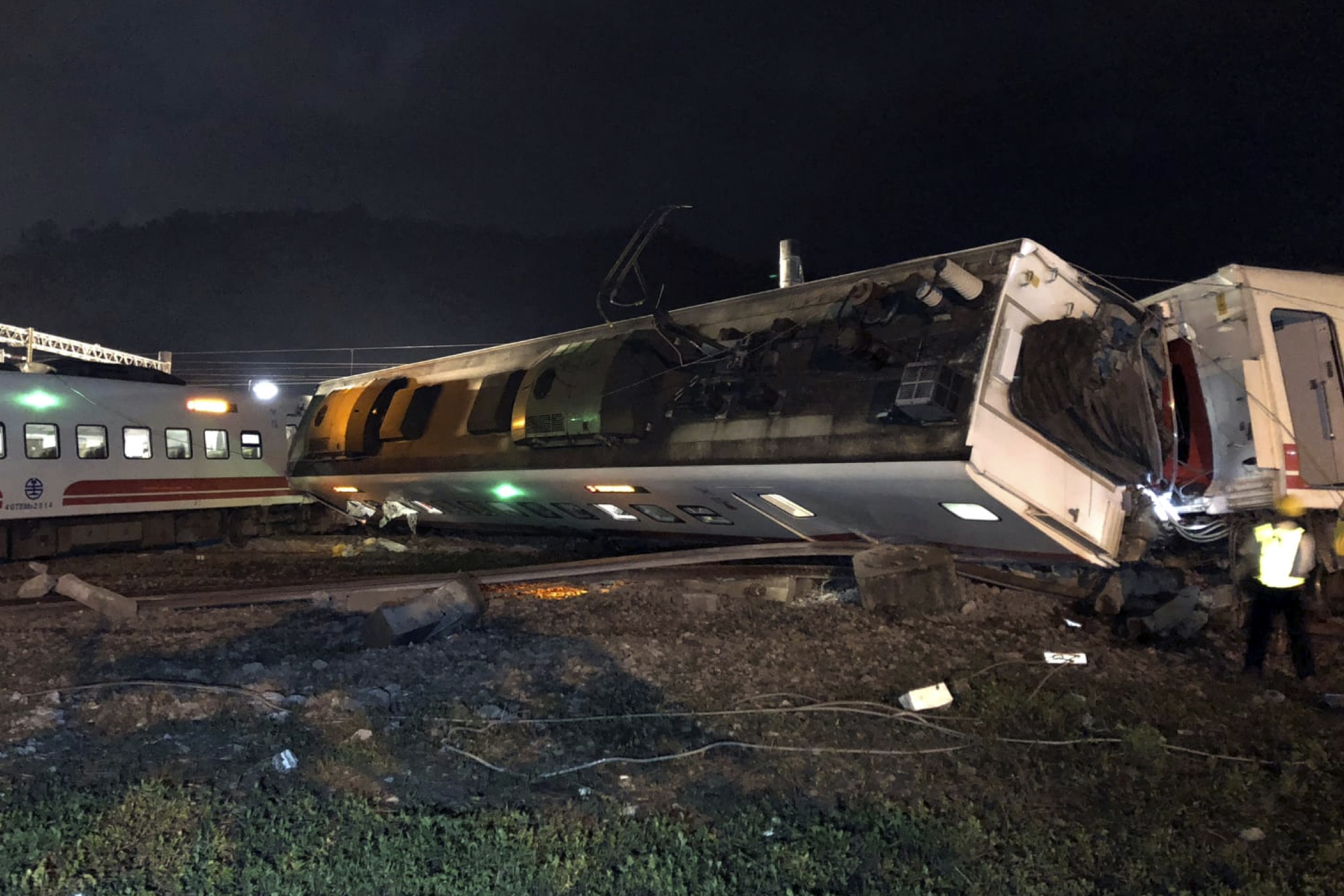 Train carriages are scattered at the site of a train derailment in Lian in northern Taiwan
