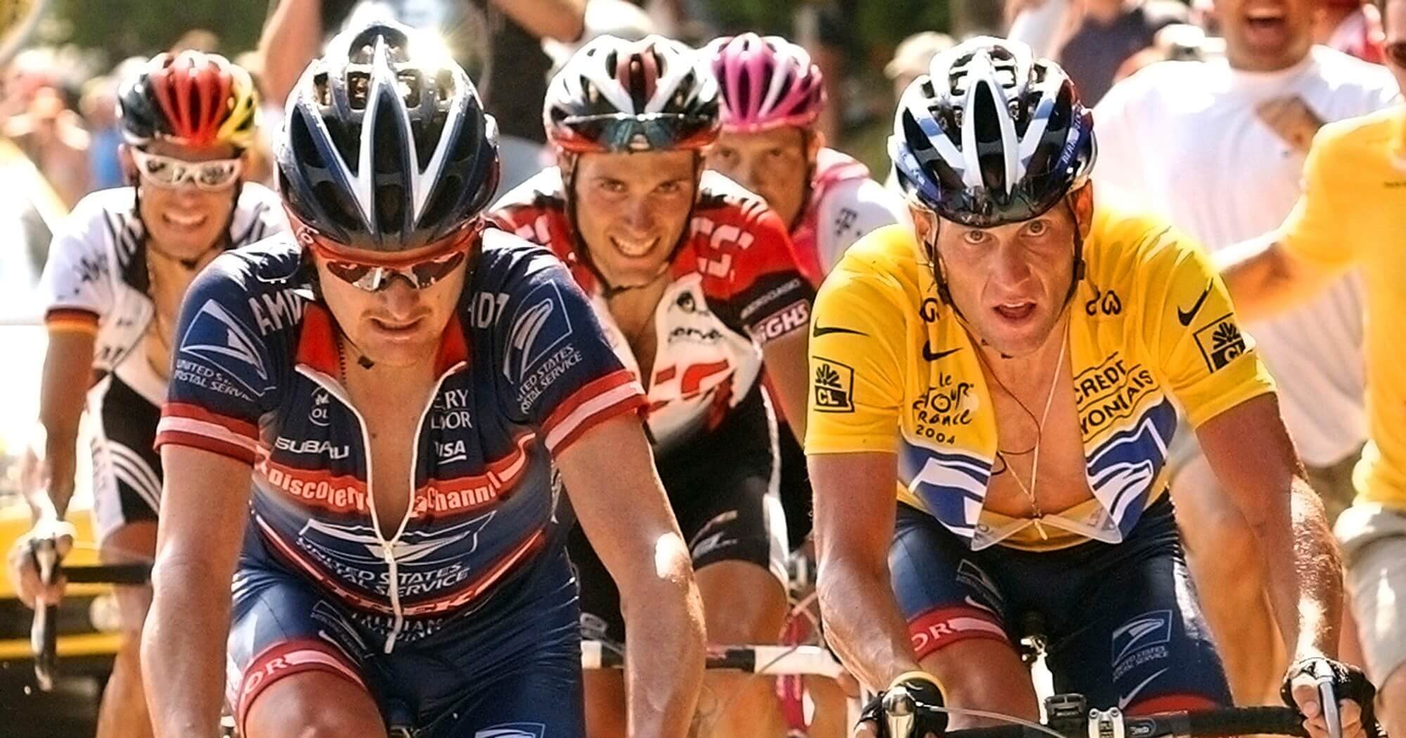 Lance Armstrong, right, follows teammate Floyd Landis, left, in the ascent of the La Croix Fry pass during the 17th stage of the Tour de France in 2004.