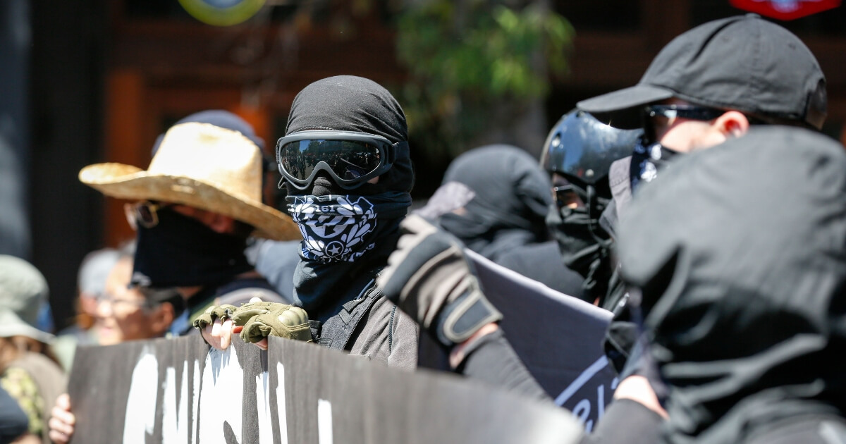 Antifa militants march with counter protesters