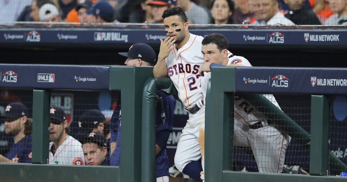 Jose Altuve, left, and Alex Bregman of the Houston Astros look on from the dugout during Game 3 of the American League Championship Series against the Boston Red Sox at Minute Maid Park on Tuesday.