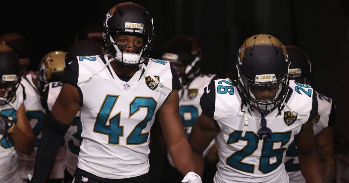 Jacksonville Jaguars players Barry Church (42) and Jarrod Wilson (26) take the field prior to a 2017 game at Arizona.