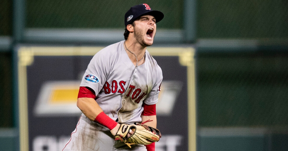 Andrew Benintendi of the Boston Red Sox reacts after catching the final out in Game 4 of the American League Championship Series against the Houston Astros on Wednesday at Minute Maid Park.