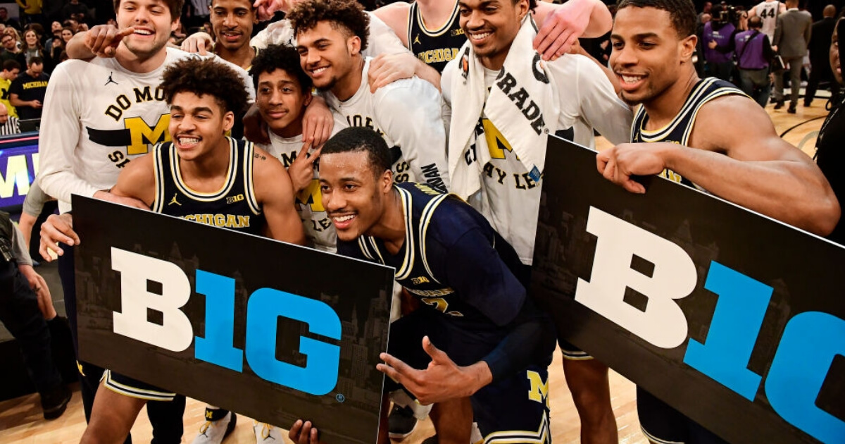 The Michigan Wolverines celebrate a win over the Purdue Boilermakers in the championship game of the 2018 Big Ten Basketball Tournament at Madison Square Garden.