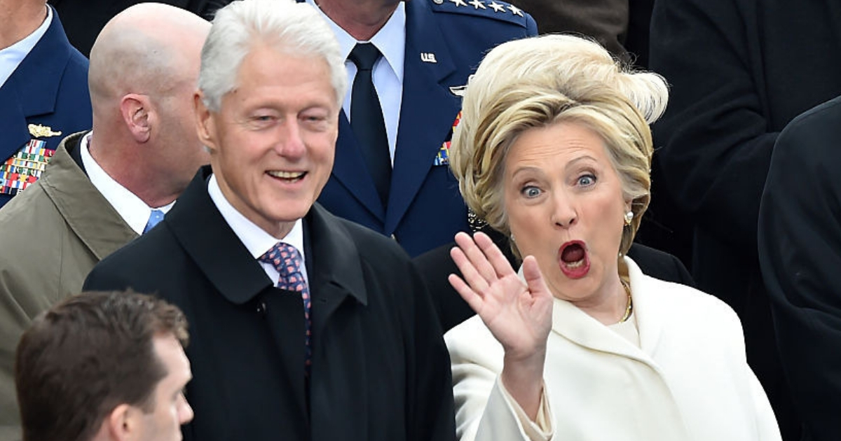 Former President Bill Clinton and former first lady Hillary Clinton wave to friends while attending the inauguration of President-elect Donald Trump in January 2017.