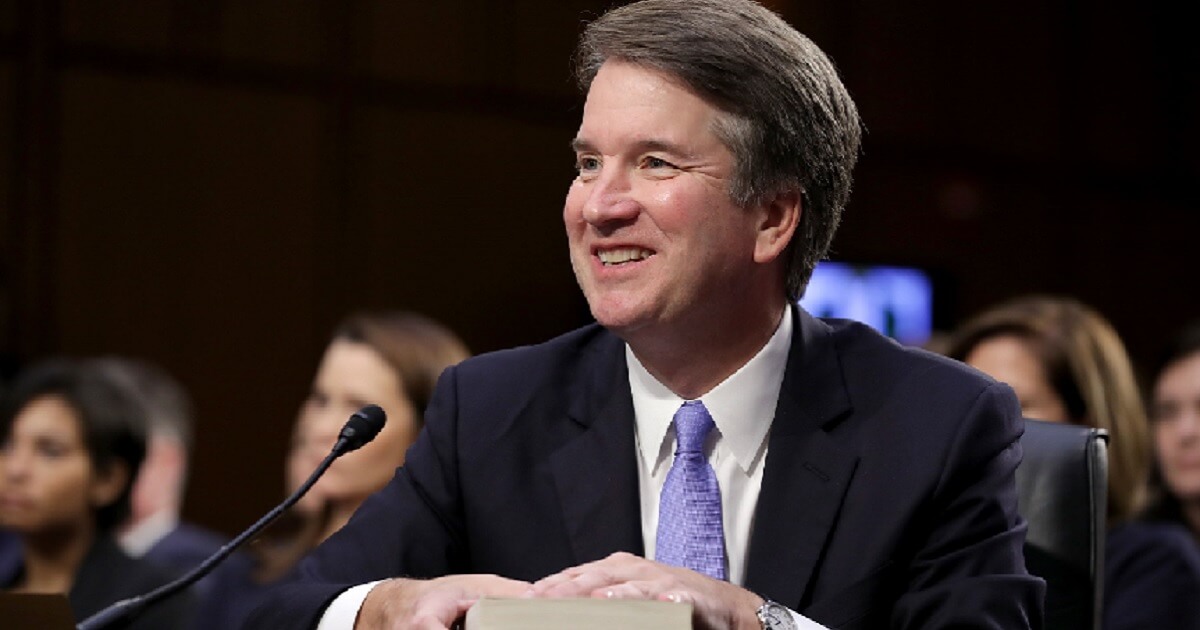 Brett Kavanaugh smiles in a picture taken Sept. 6 at the beginning of his third day of testimony during confirmation hearings.