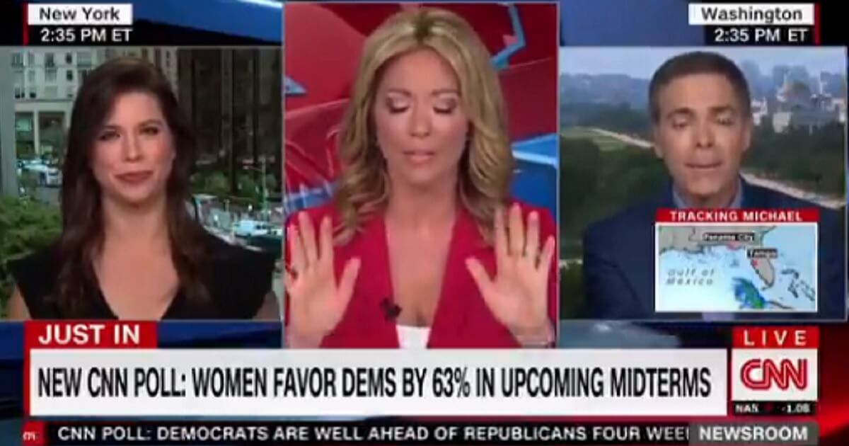 Brooke Baldwin holds up her hands with her eyes closed.