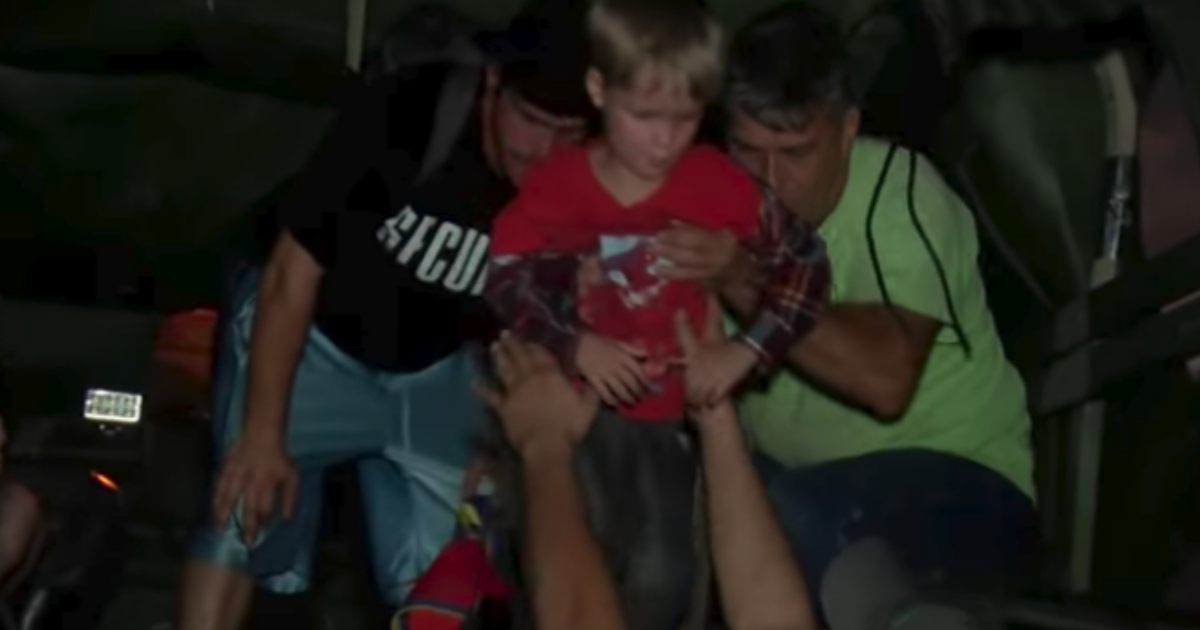 Cajun Navy volunteers help a young boy and his family reach safety in the aftermath of Hurricane Michael in Panama City Beach, Florida.