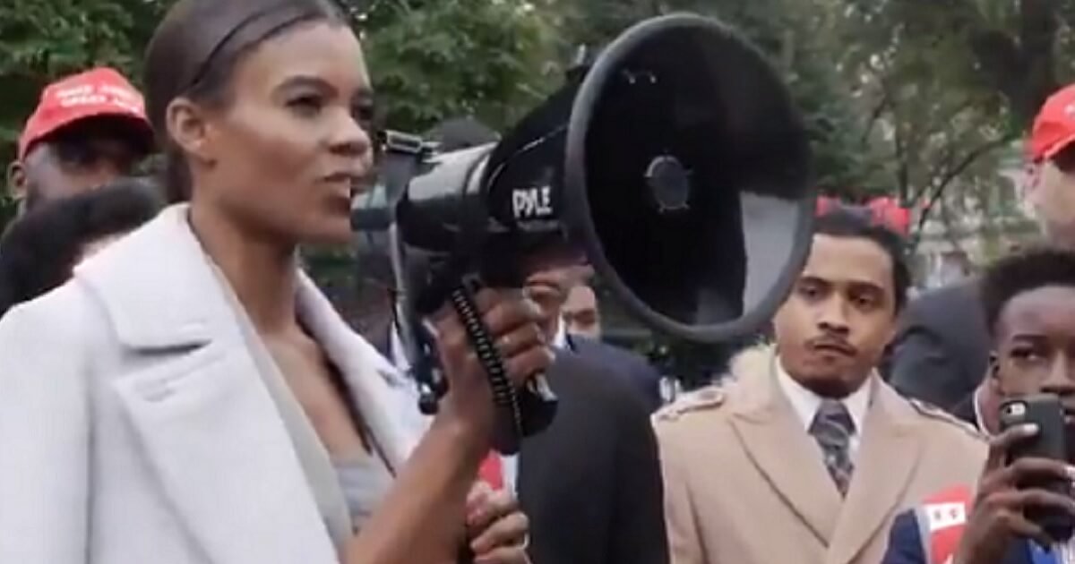 Candace Owens, communications director for the conservative group Turning Point USA, uses a bullhorn to address a crowd Saturday in Washingotn.