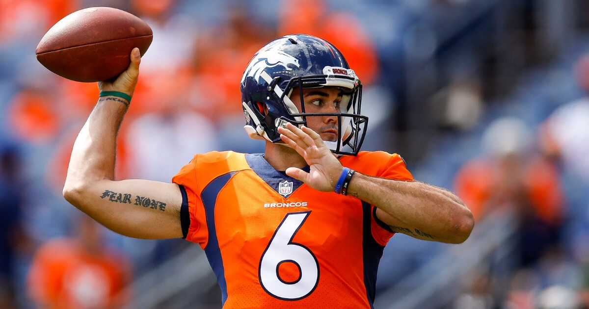 Quarterback Chad Kelly of the Denver Broncos warms up before a game against the Oakland Raiders at Mile High on Sept. 16.