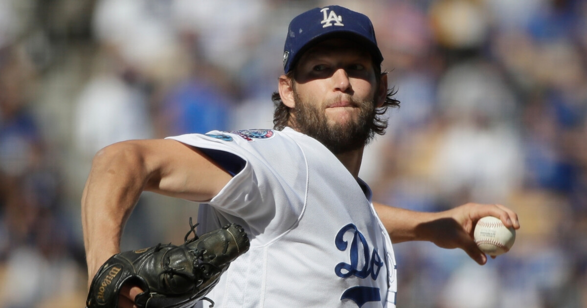 Clayton Kershaw throws during the first inning of Game 5 of the National League Championship Series.