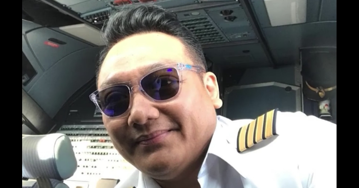 A pilot in uniform.
