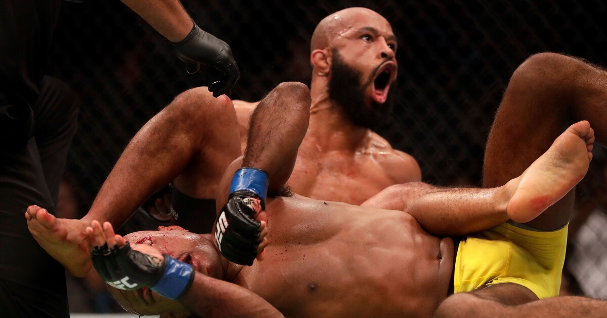 Demetrious Johnson celebrates as he defeats Wilson Reis in their championship bout on UFC Fight Night on April 15, 2017, in Kansas City, Missouri.