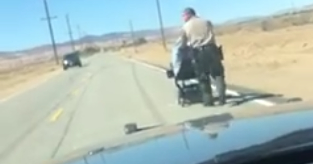 Deputy Pushes Wheelchair