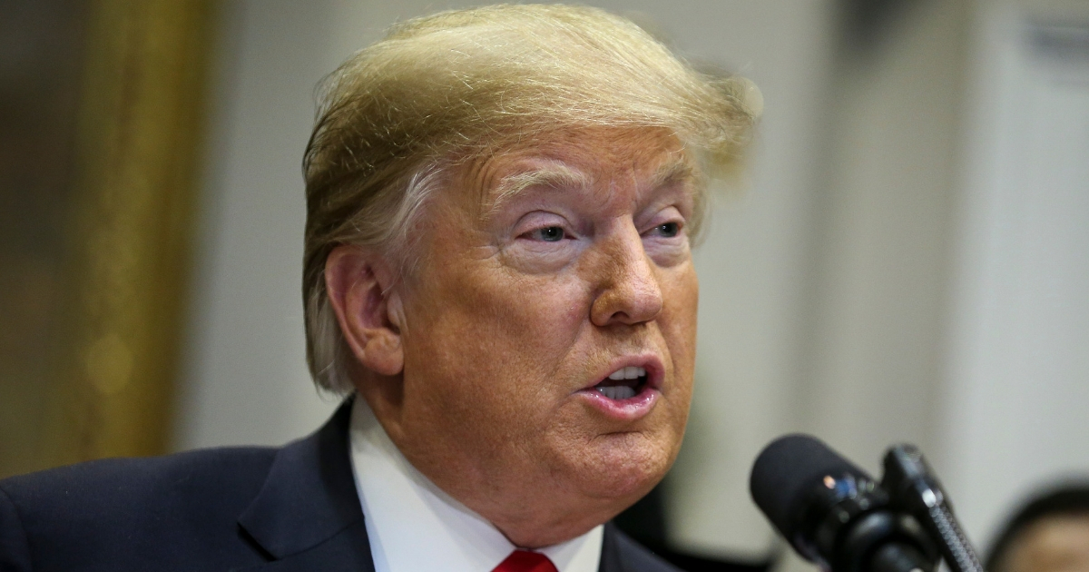 President Donald Trump talks to reporters at the White House.