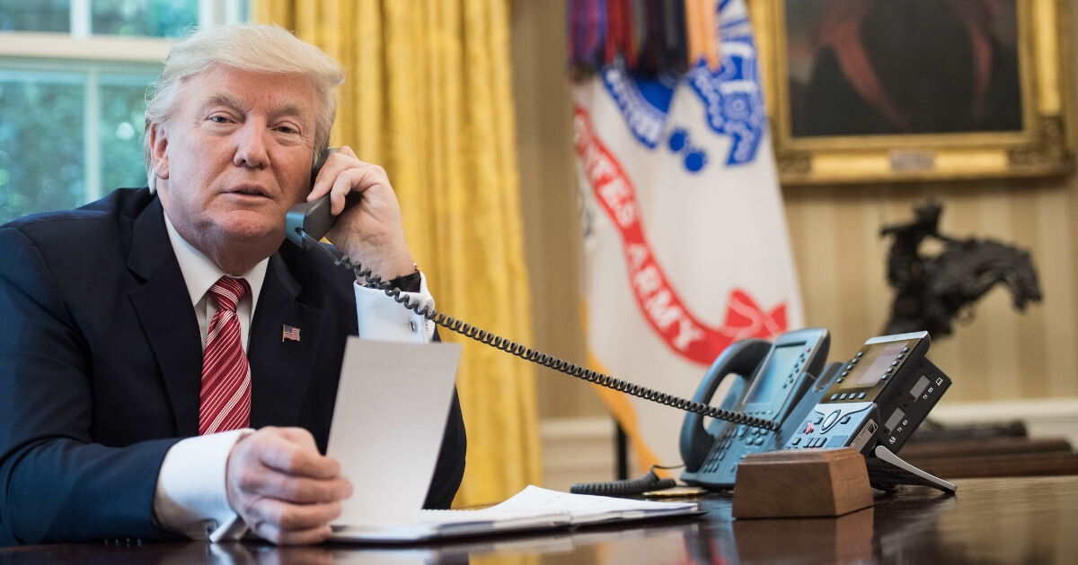 US President Donald Trump speaks on the phone