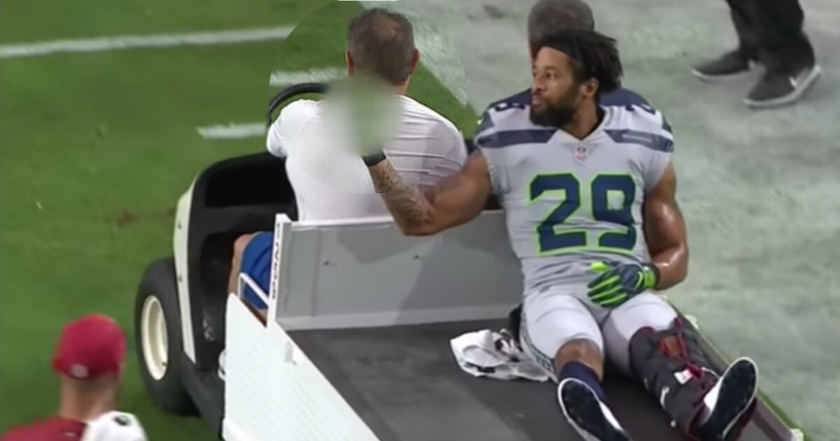 Seattle's Earl Thomas gives a middle-finger gesture toward the Seahawks sideline after leaving the field with an injury Sunday at Arizona.