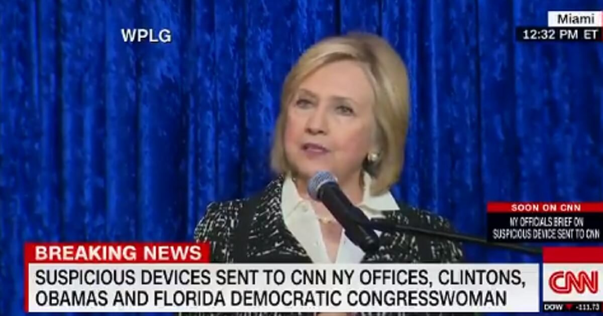 Former Democratic presidential candidate Hillary Clinton speaks Wednesday after packages containing explosive devices were to homes of prominent Democrats and CNN's offices in New York.