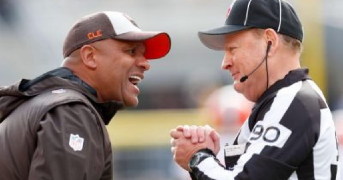Cleveland Browns head coach Hue Jackson, left, talks with an official during Cleveland's loss at Pittsburgh on Sunday.