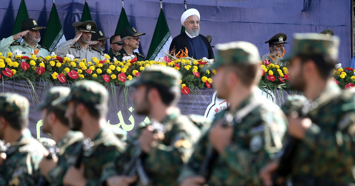 Iran's President Hassan Rouhani reviews army troops marching during the 38th anniversary of Iraq's 1980 invasion of Iran, in front of the shrine of the late revolutionary founder, Ayatollah Khomeini, outside Tehran, Iran, Saturday, Sept. 22.