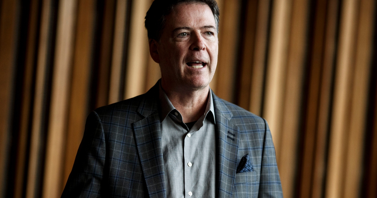 Former FBI Director James Comey talks backstage before a panel discussion about his book 'A Higher Loyalty' on June 19, 2018 in Berlin, Germany.