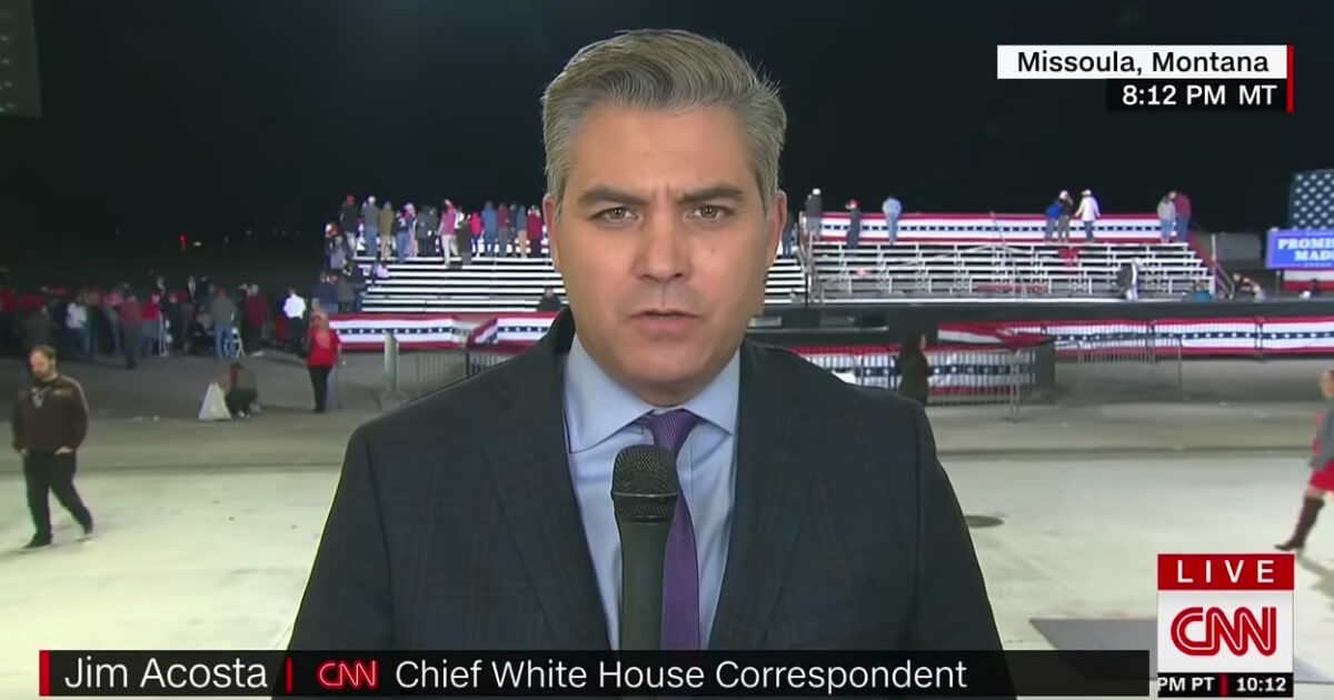 Jim Acosta talks on air at Trump rally.