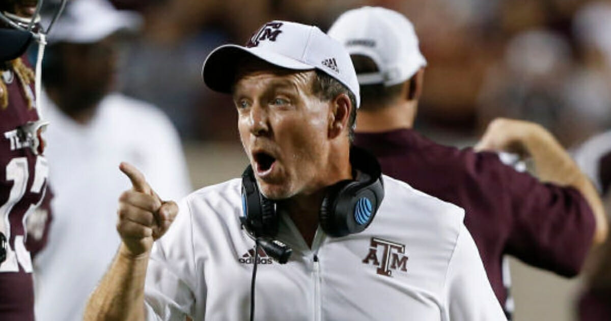 Texas A&M coach Jimbo Fisher is facing criticism for grabbing one of his own players by the face mask during Saturday's win over Arkansas.