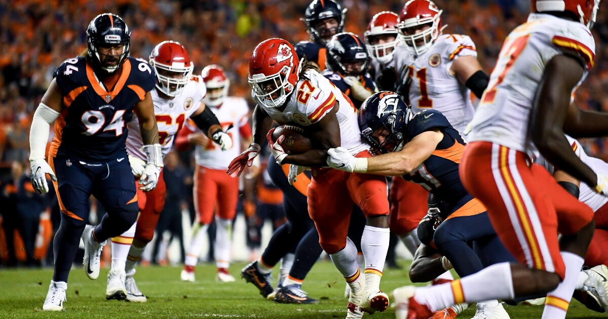 Running back Kareem Hunt of the Kansas City Chiefs scores a fourth-quarter go-ahead touchdown against the Denver Broncos at Mile High on Monday night.