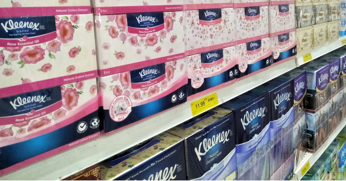 Kleenex brand tissues on a supermarket shelf.